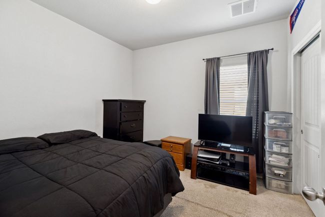 Bedroom with carpet flooring | Image 18