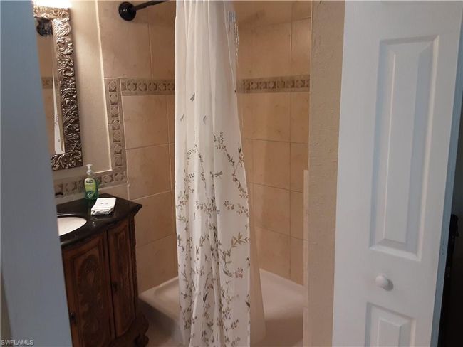 Full bathroom featuring vanity and tiled shower | Image 13