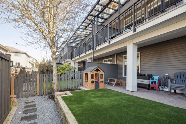 View of yard with a patio and fence | Image 35