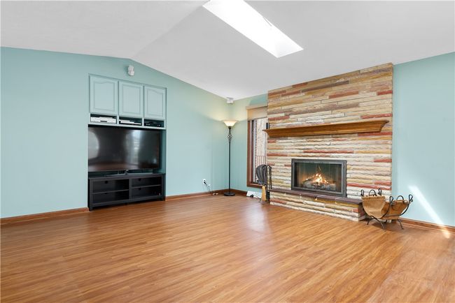 View of the cozy, gas fireplace. | Image 15