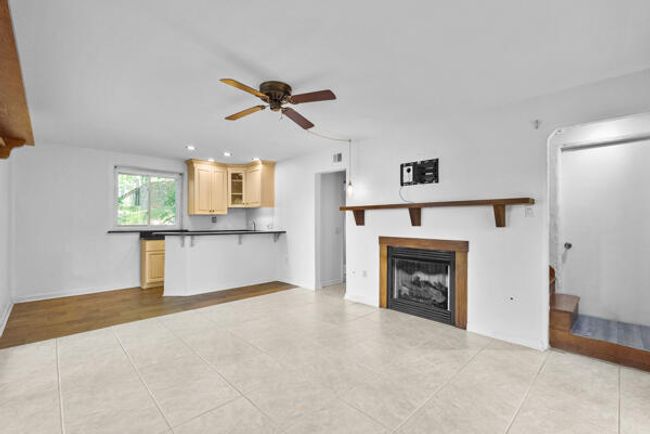 Basement area with fireplace | Image 28