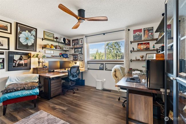 This home offers three bedrooms on the main level, with one currently being utilized as a comfortable and functional office that can provide work-from-home convenience. Additionally, there is a fourth bedroom located on the lower level, providing flexibility to suit your unique needs | Image 20