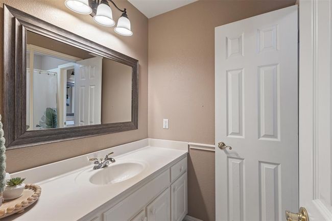 Separate vanity for the second bedroom with shared hallway entrance. | Image 23