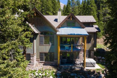 Rear view of property featuring a patio and a balcony | Image 1