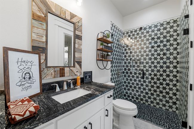 Full bath with toilet, vanity, a stall shower, and tile patterned floors | Image 14