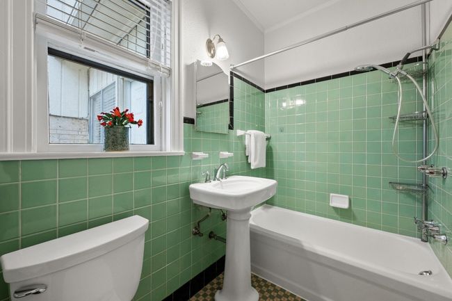 Primary bath with vintage tiles. | Image 24