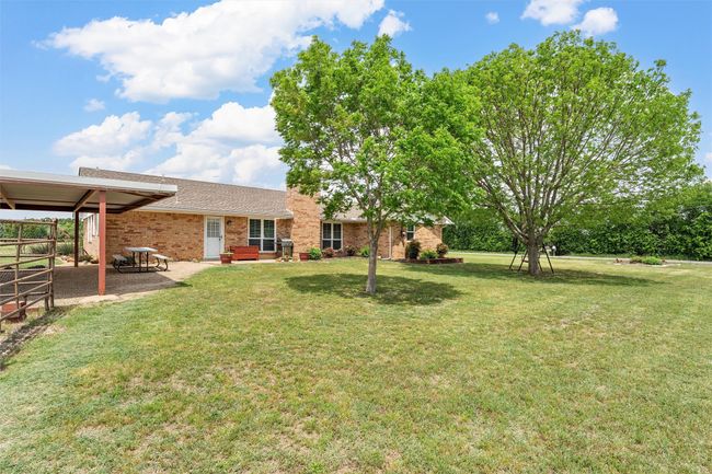 View of grassy yard with a patio | Image 28