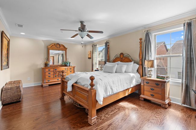 Wood floors, tall ceilings, and abundant natural light all enhance your space. | Image 13