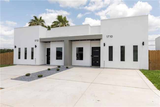 View of front facade featuring stucco siding | Image 12