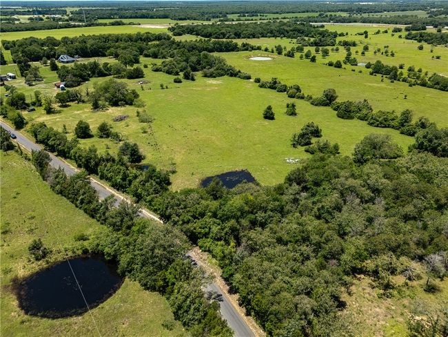View of rural area featuring a nearby body of water | Image 5