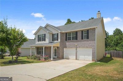 5675 Star Flower Drive, House other with 5 bedrooms, 3 bathrooms and null parking in Ellenwood GA | Image 1