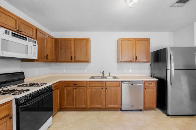 Gas range/oven, microwave, dishwasher. Stainless Steel fridge is negotiable. | Image 10