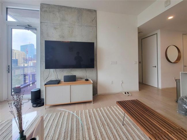 Living room with plenty of natural light and light wood-type flooring | Image 7
