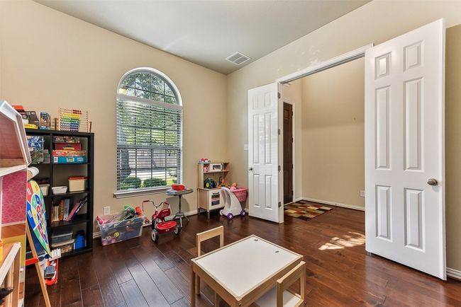 Tucked behind french doors at the front of the home, this dedicated study offers the ideal spot for focus, whether you're working remotely, managing the household, or dreaming up your next big idea | Image 4