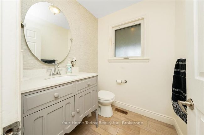 Bathroom with vanity, hardwood / wood-style flooring, and toilet | Image 24