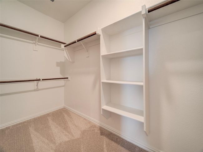 Walk in closet featuring carpet flooring | Image 27