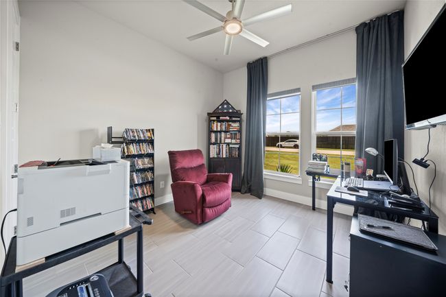 Office space featuring ceiling fan and baseboards | Image 26