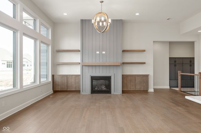 Family room featuring fireplace, recessed lighting, and light wood-style floors. | Image 11