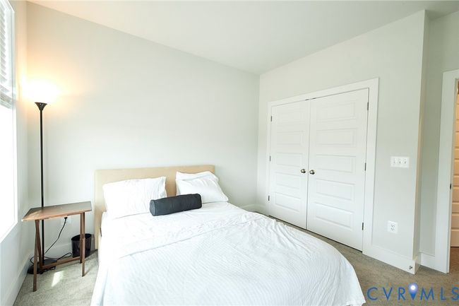 Carpeted bedroom with baseboards and a closet | Image 23