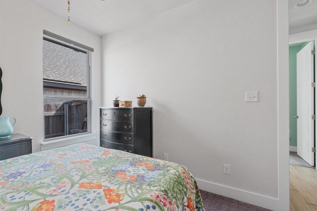 Bedroom featuring baseboards and wood finished floors | Image 25