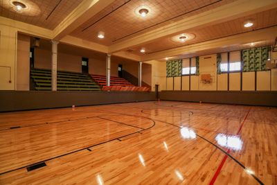 This original school building has been renovated into a unique residential space complete with a full court basketball court! | Image 2