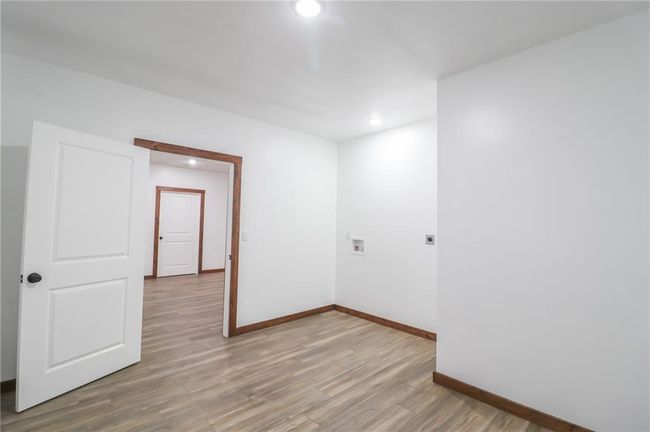 Empty room with light hardwood / wood-style floors | Image 41