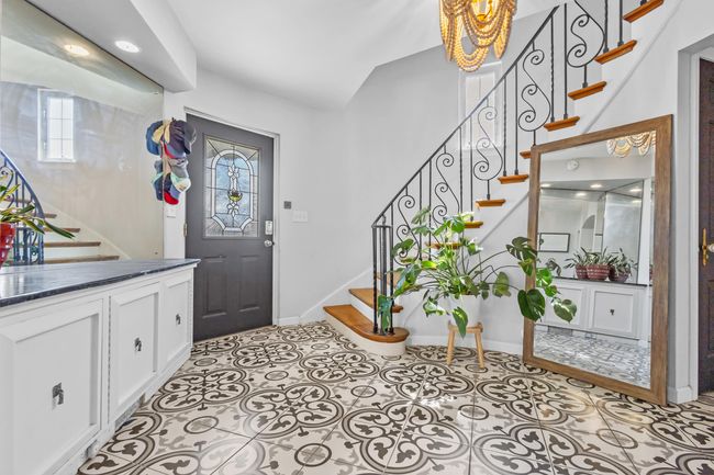 Inviting Foyer w/ Spiral Staircase | Image 4