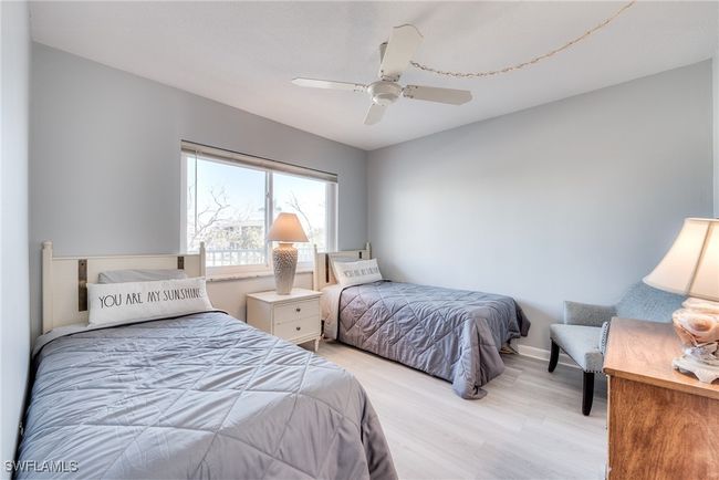 Bedroom with ceiling fan and light hardwood / wood-style flooring | Image 10