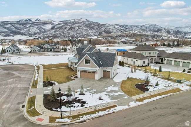 Snowy aerial view featuring a residential view and a mountain view | Image 55