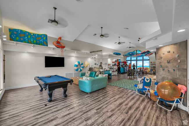 Recreation room featuring wood finished floors, a ceiling fan, billiards table, and baseboards | Image 20