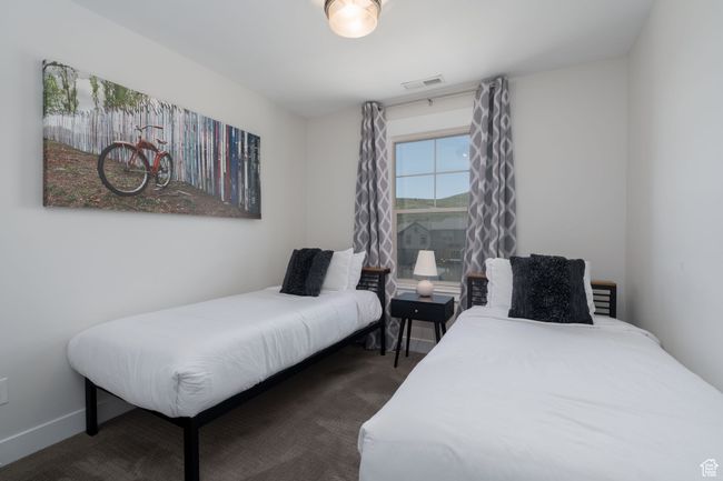 Bedroom with dark colored carpet | Image 32