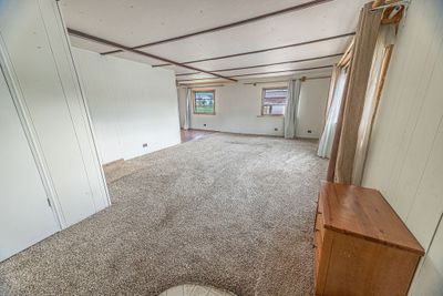 View of carpeted spare room | Image 3