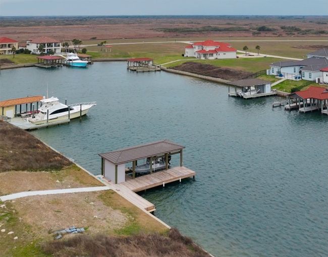 Dock area featuring a residential view and a water view | Image 9