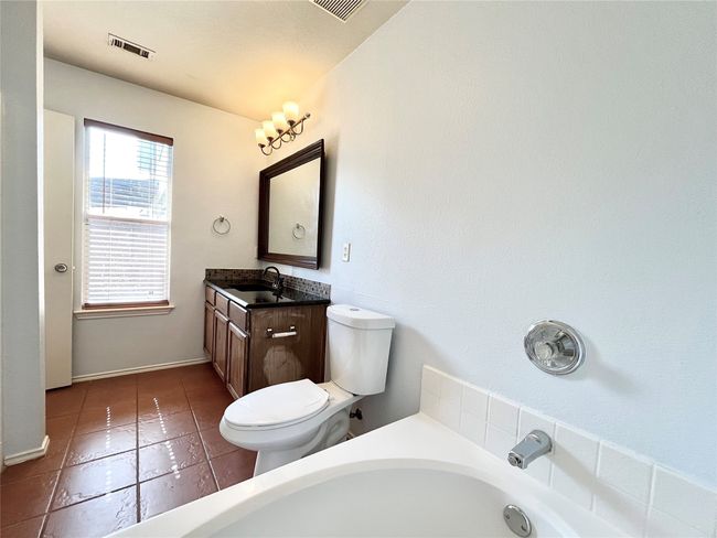 Full bathroom featuring a bath, vanity, and tile patterned flooring | Image 15