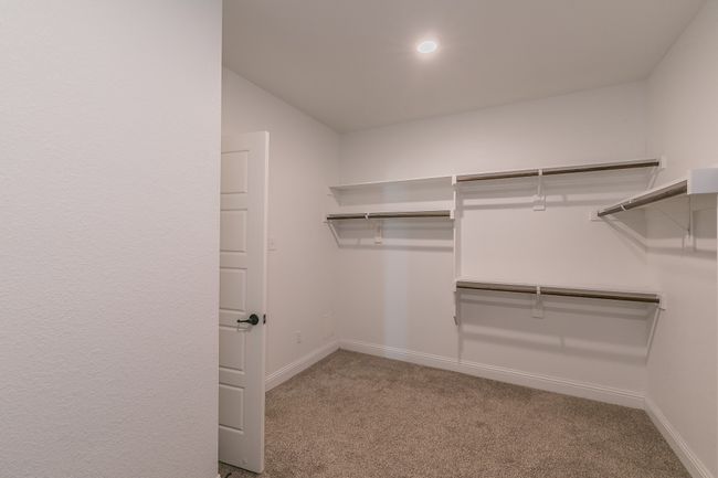 Spacious closet featuring carpet flooring | Image 32