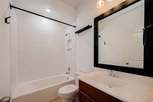 Main bathroom tub and shower tiled | Image 31