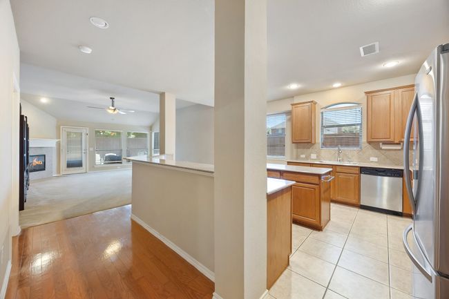 Island and breakfast bar kitchen open to family room | Image 8