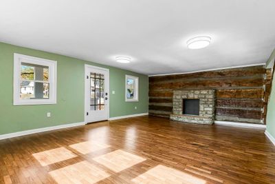 Family Room with hardwood floors and new windows. | Image 2