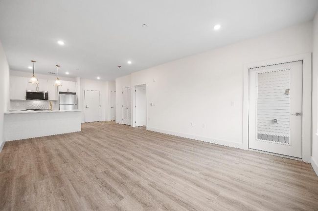 Unfurnished living room with recessed lighting, light wood-style flooring, and baseboards | Image 37