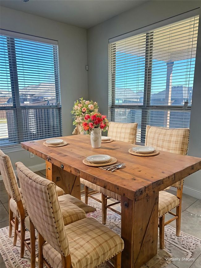 Dining space with baseboards | Image 7