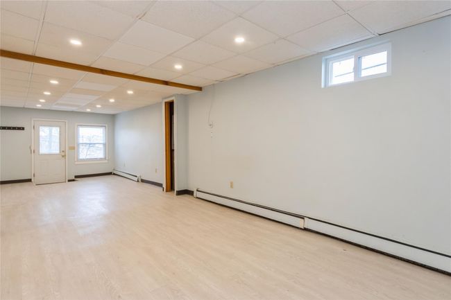 Family room has door out to the driveway. | Image 20