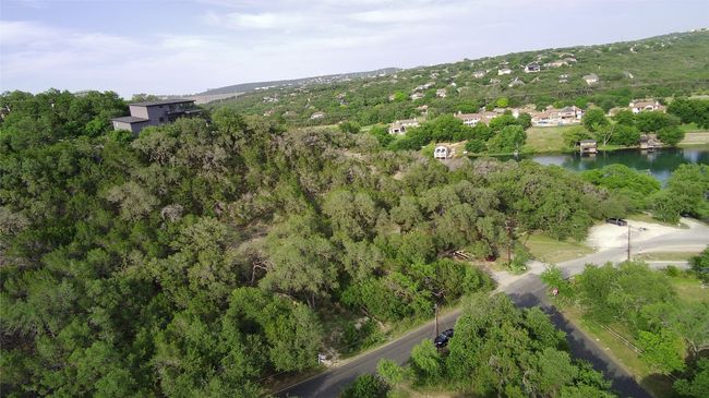 Aerial view of property and surrounding area with a nearby body of water | Image 4