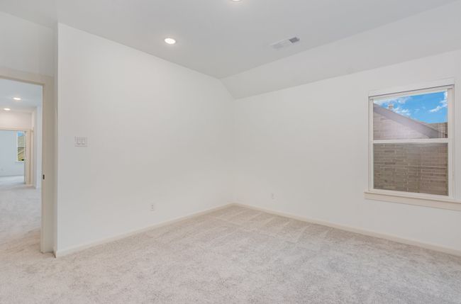 Unfurnished room with light colored carpet, healthy amount of natural light, recessed lighting, and lofted ceiling | Image 22