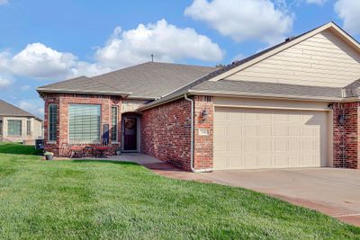 Single story home with a front yard and a garage | Image 2