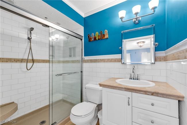 FULLY UPDATED PRIMARY BATHROOM WITH BEAUTIFUL STYLISH TILE WALLS/SHOWER - NEW VANITY | Image 19