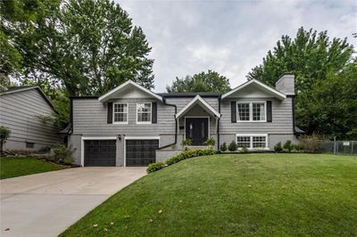 Split foyer home with coveted two car garage featuring new exterior paint ('23) & newer landscaping | Image 1