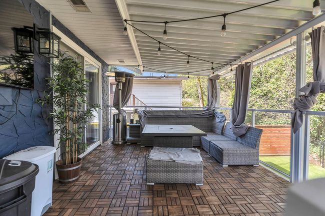 Sunroom with an outdoor hangout area | Image 32