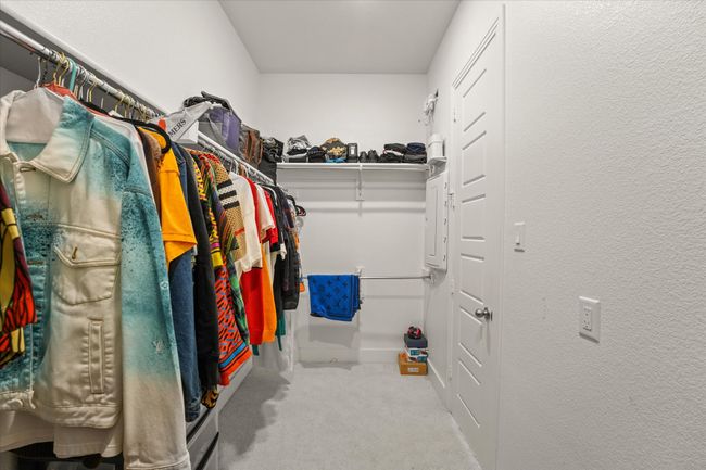 Walk in closet featuring carpet flooring | Image 16