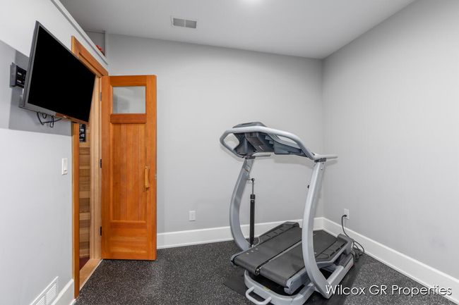 Lower level finished area features a custom built sauna waiting to sooth your stress away! | Image 33