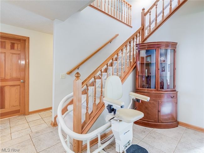 Staircase featuring light tile floors | Image 4